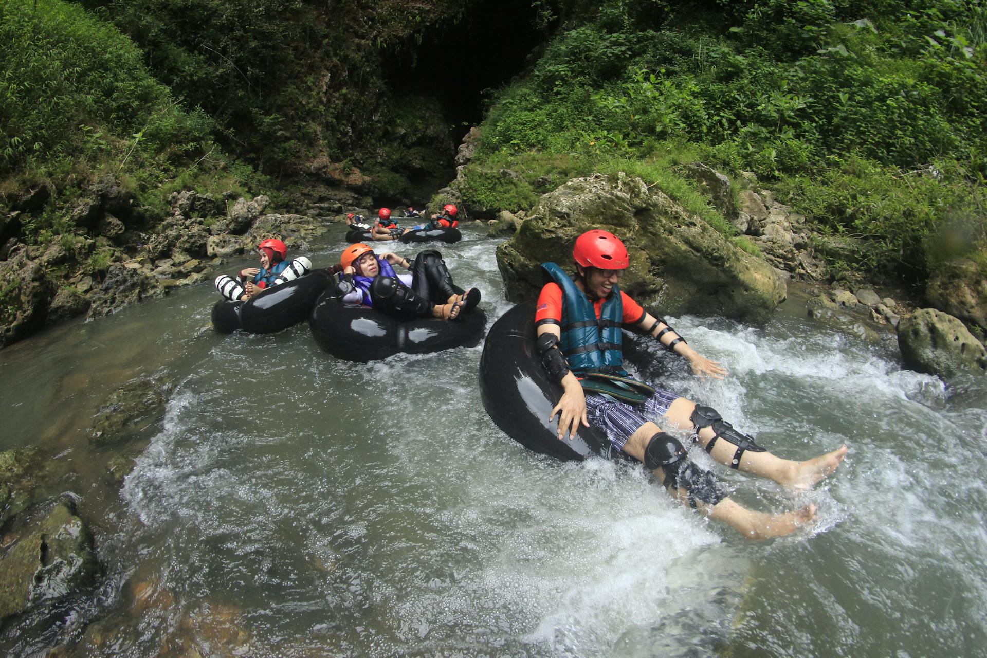 People tubing down a river